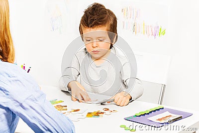 Concentrated solve puzzle during developing game Stock Photo