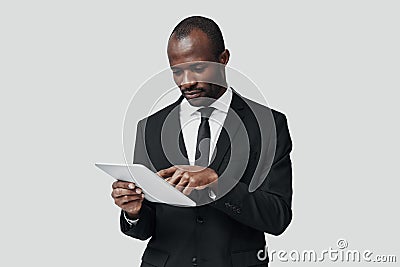 Concentrated young African man in formalwear Stock Photo