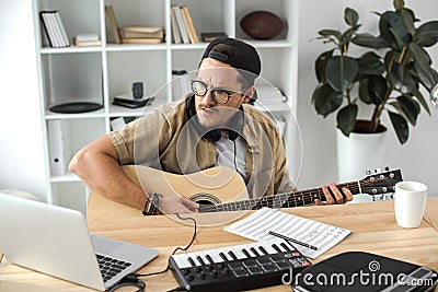 Musician playing guitar Stock Photo