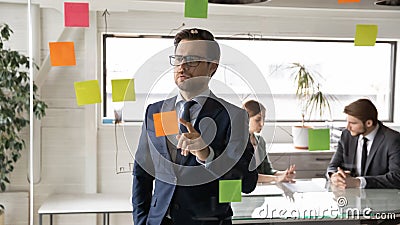 Concentrated young 30s confident skilled ceo executive male analyzing strategy. Stock Photo