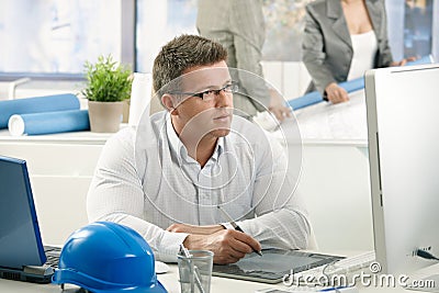 Concentrating architect at work Stock Photo