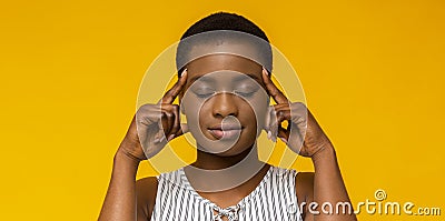 African american woman thinking hard with eyes closed Stock Photo