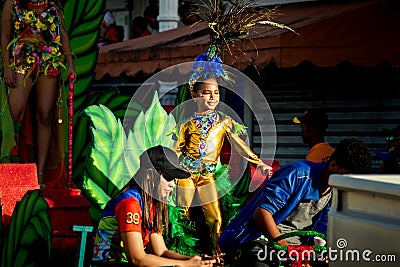 Closeup young queen of carnival riding on open platform at dominican city street Editorial Stock Photo