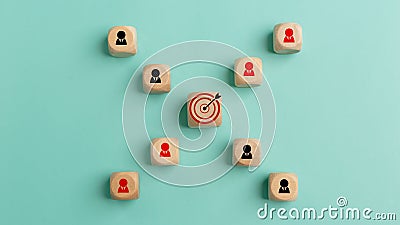 Concept of achieving goals by cooperating with team members with a human icon for customer focus target group and customer Stock Photo