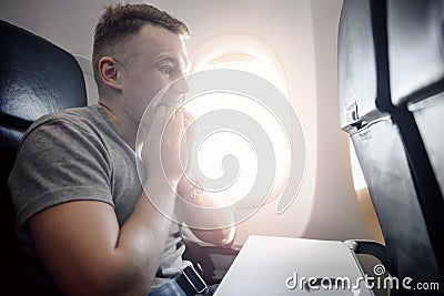 Concept aerophobia. Afraid of fear flying on an airplane and at height Stock Photo