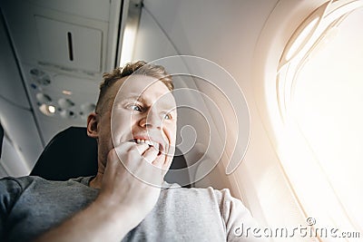 Concept aerophobia. Afraid of fear flying on an airplane and at height Stock Photo