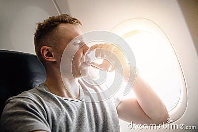 Concept aerophobia. Afraid of fear flying on an airplane and at height. drink water Stock Photo