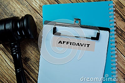 Concept of Affidavit write on paperwork isolated on Wooden Table Stock Photo