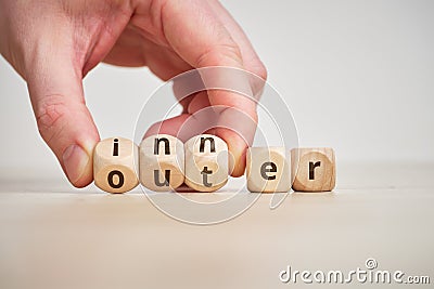 Concept of antonym inner and outer on wooden blocks Stock Photo