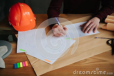 Concept architects,engineer holding pen pointing equipment architects On the desk with a blueprint in the office Stock Photo