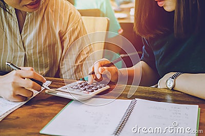 Concept architects, Two asian young woman engineer using calculator for calculation number of structural materials architects On Stock Photo