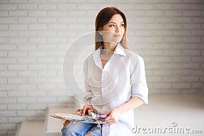 Concept Artist Beautiful girl. Beautiful women are creating art. Young artist painting in the house Stock Photo