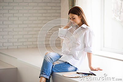 Concept Artist Beautiful girl. Beautiful women are creating art. Young artist painting in the house. Stock Photo