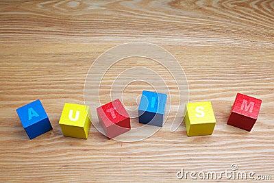 Concept of autism word on colored wooden cubes Stock Photo