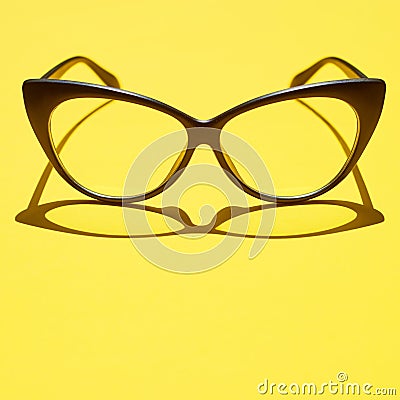 Concept background of black glasses floating above the yellow sp Stock Photo