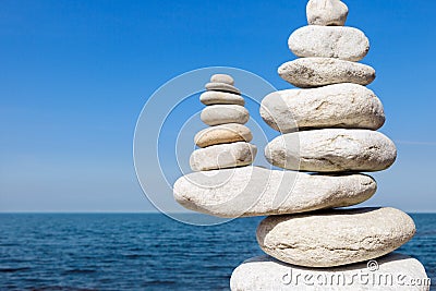 Concept of balance and harmony. White rocks zen on the sea. Stock Photo