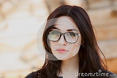 Concept: beautiful eyes, beautiful smile, vision, perfect skin Portrait of a beautiful girl with glasses, eyes closed, shot close- Stock Photo