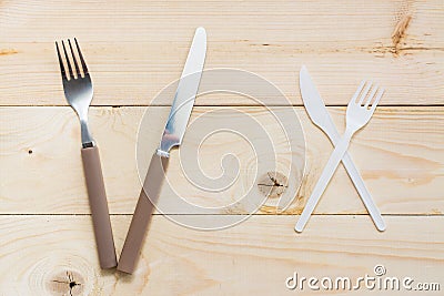 The concept of the benefits of reusable cutlery over disposable plastic. Stock Photo