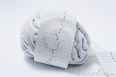 Concept of brain exam as ECG waves. Shape of human brain entwined with paper tape elektrokardiogrammy wave, which displays process Stock Photo