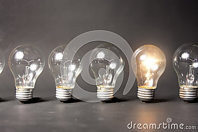 Concept of bright idea with series of light bulbs Stock Photo