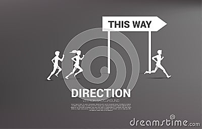 Silhouette businessman and businesswoman running to with direction signage. Stock Photo