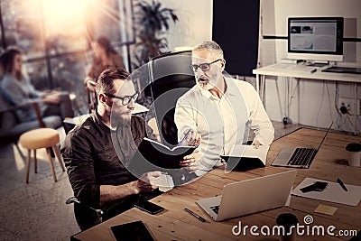 Concept of business people brainstorming process.Bearded adult man making notes in notebook.Coworkers teamwork in modern Stock Photo