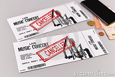 Concept for cancelled entertainment events with concert tickets and red `cancelled` stamp on them Stock Photo