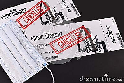 Concept for cancelled entertainment events during Corona virus pandemic with concert tickets and red `cancelled` stamp Stock Photo