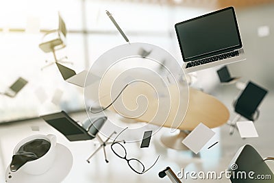 Concept of chaos in a modern office, with flying computers, chai Stock Photo