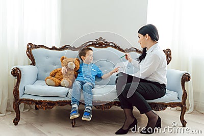 The concept of child psychology. A boy at the psychologist Stock Photo