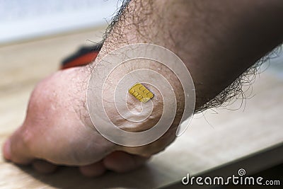 Concept chipization of the population microchip mounted in the human hand Stock Photo