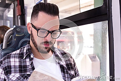 Concept of commute, mobility. University student man sitting and Stock Photo