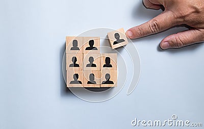 Top view hand place wooden blocks people icon. Stock Photo