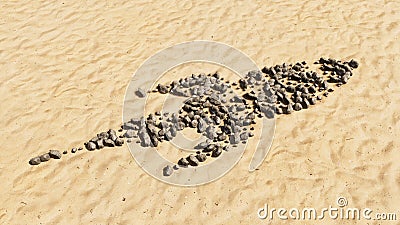 Stones on beach sand handmade symbol shape, golden sandy background, sign of a rocket Cartoon Illustration