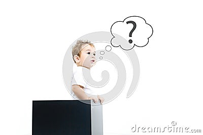 Concept for confusion, inspiration and solution. little boy looks out of the box, looking for the answer, the question mark, the Stock Photo