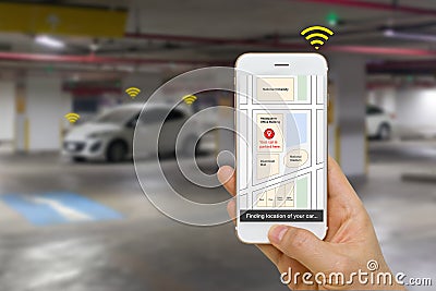 Connected Car Concept Illustrated by Smartphone App Showing Parking Location of the Car Via IOT or Internet of Things Technology Stock Photo