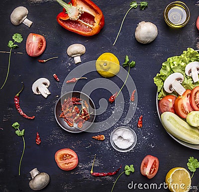 Concept cooking vegetarian food on pan mushroom parsley tomato salt hot red pepper and lemon Stock Photo