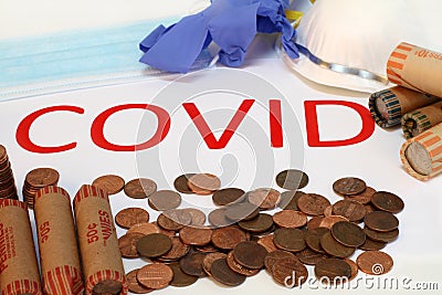 The concept of counting pennies due to Covid with loose and wrapped coins and the word COVID Stock Photo