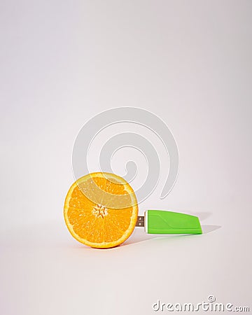 concept creative orange with usb flash memory device in it.colorful abstract design Stock Photo