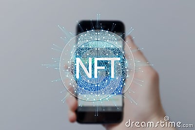 Concept cryptographic NFT. Blockchain network, hand holding smartphone with type of cryptographic non-fungible tokens Stock Photo