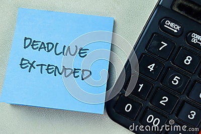 Concept of Deadline Extended write on sticky notes isolated on Wooden Table Stock Photo