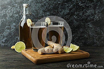 Concept of delicious drink with glasses and bottle of ginger beer on wooden table Stock Photo