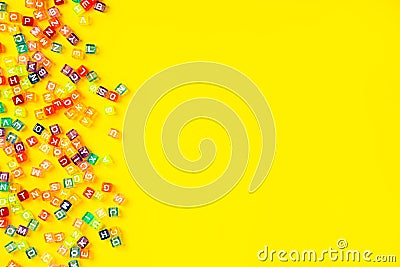 The concept of developing thinking, grammar, returning to school, learning. Top view of multicolored cubes with the Stock Photo