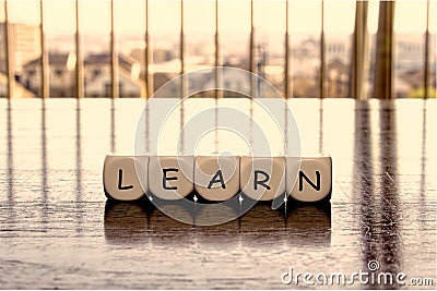 5 dices forming the Word `learn` Stock Photo