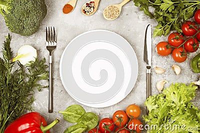 Concept dietary and vegetable food. White plate. Various vegetables and spices (broccoli, pepper, cherry Stock Photo