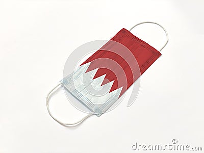 Concept. Disposable medical surgical face mask with Bahrain country flag superimposed on it, on white background. Protection again Stock Photo