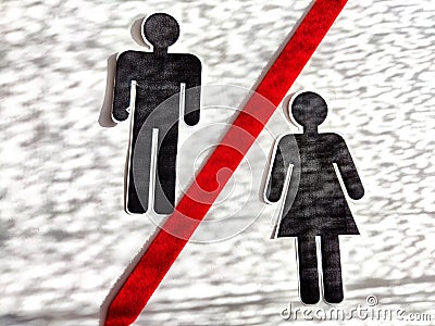 Concept of divorce, quarrels, and separation of a couple. Paper black figurines of a man and a woman separated by red Stock Photo