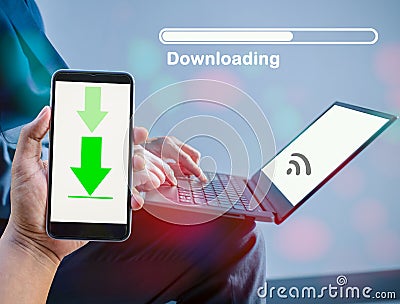 Concept of downloading data via mobile phone using computer via internet, online system Stock Photo