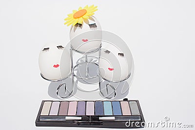 The concept of Easter to paint eggs, make up on white background Stock Photo