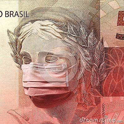 Coronavirus - Fifty brazilian reais banknote face wearing a mask Stock Photo